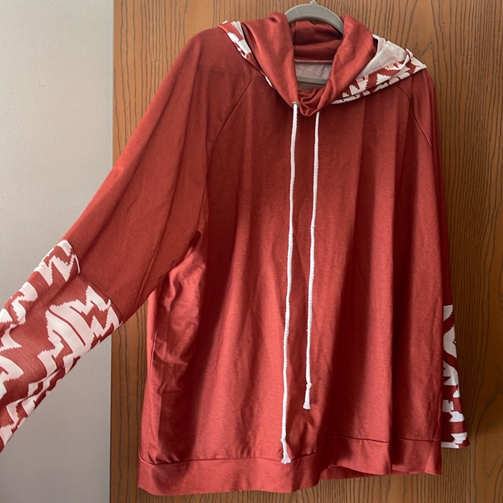 Brand new orange and white hooded sweatshirt from Temu.